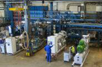 Top view of a factory floor with worker operating the machines